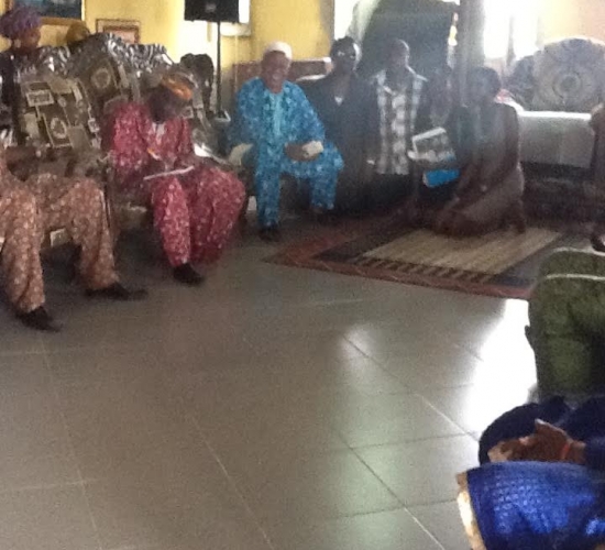 The Wocon Team (kneeling) Taking Pictures with High Chief Dr. Owheton Ahunbe II